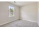 Simple bedroom with neutral wall paint and carpeting at 1758 Eagle St # C, Aurora, CO 80011