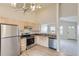 Open kitchen featuring stainless steel appliances and light wood cabinetry at 1758 Eagle St # C, Aurora, CO 80011