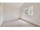 Spacious bedroom with neutral carpeting and large window at 1758 Eagle St # C, Aurora, CO 80011