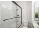 Clean bathroom with a glass shower and bathtub at 12048 E Canal Dr, Aurora, CO 80011