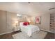 Basement bedroom with a plush bed and bookshelves at 12048 E Canal Dr, Aurora, CO 80011