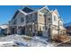 Modern two-story townhome with snow-covered landscaping at 23539 E Ida Dr # A, Aurora, CO 80016