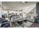 Open concept kitchen and living area with modern appliances and ample natural light at 6747 Raritan Dr, Denver, CO 80221