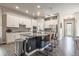 Modern kitchen with a large island, stainless steel appliances, and ample counter space at 6747 Raritan Dr, Denver, CO 80221