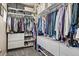 Large walk-in closet with ample shelving and hanging space at 6747 Raritan Dr, Denver, CO 80221