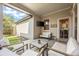 Covered patio with seating area and view of backyard at 6747 Raritan Dr, Denver, CO 80221