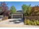 House exterior with driveway and landscaping at 6747 Raritan Dr, Denver, CO 80221
