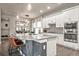 Modern kitchen with stainless steel appliances and a large island at 6747 Raritan Dr, Denver, CO 80221