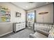 Spacious Bedroom with crib, dresser, and plenty of storage at 6747 Raritan Dr, Denver, CO 80221