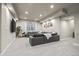 Finished basement with sectional sofa and entertainment area at 6747 Raritan Dr, Denver, CO 80221