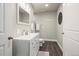 Basement bathroom with white vanity, toilet and dark flooring at 6747 Raritan Dr, Denver, CO 80221