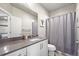 Clean bathroom with single vanity and shower/tub combo at 6747 Raritan Dr, Denver, CO 80221