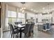 Spacious dining area with a large table and chairs, near the kitchen at 6747 Raritan Dr, Denver, CO 80221