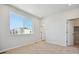 Spacious bedroom with neutral carpet and large window at 461 Interlocken Blvd # 103, Broomfield, CO 80021