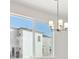 Bright dining room with large window and modern chandelier at 461 Interlocken Blvd # 103, Broomfield, CO 80021