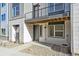 Private back entrance with patio and exterior storage at 461 Interlocken Blvd # 103, Broomfield, CO 80021