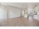Open concept kitchen with white cabinets, island, and stainless steel appliances at 461 Interlocken Blvd # 103, Broomfield, CO 80021