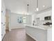 Open concept kitchen with island and stainless steel appliances at 461 Interlocken Blvd # 103, Broomfield, CO 80021