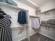Spacious walk-in closet with ample hanging and shelving space at 5150 N Quemoy Ct, Aurora, CO 80019