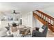 Open concept living space with kitchen, dining area, and stairs at 1100 S Waco St # G, Aurora, CO 80017