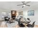 Bright living room with fireplace, dining area, and hardwood floors at 1100 S Waco St # G, Aurora, CO 80017