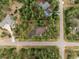 Aerial view of a house nestled in a wooded lot at 4381 Cheyenne Dr, Larkspur, CO 80118