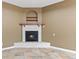Basement corner fireplace with rustic wood mantel at 4381 Cheyenne Dr, Larkspur, CO 80118