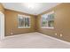 Bright bedroom with double windows and neutral walls at 4381 Cheyenne Dr, Larkspur, CO 80118