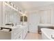 Spa-like bathroom with double sinks, soaking tub, and modern lighting at 4381 Cheyenne Dr, Larkspur, CO 80118
