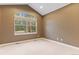 Bright bedroom with large window and neutral decor at 4381 Cheyenne Dr, Larkspur, CO 80118