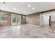 Spacious finished basement with tile flooring and large windows at 4381 Cheyenne Dr, Larkspur, CO 80118