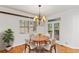 Bright dining room with hardwood floors and chandelier at 4381 Cheyenne Dr, Larkspur, CO 80118