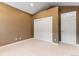 Bright bedroom with double closets and neutral walls at 4381 Cheyenne Dr, Larkspur, CO 80118