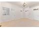 Spacious bedroom with carpet, chandelier, and large windows at 4381 Cheyenne Dr, Larkspur, CO 80118