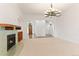 Spacious living room with a beautiful fireplace and built-in shelves at 4381 Cheyenne Dr, Larkspur, CO 80118