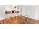 Hardwood floors and views to the living room and fireplace at 4381 Cheyenne Dr, Larkspur, CO 80118