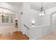 Hardwood floors and two-story entryway with views to Gathering room at 4381 Cheyenne Dr, Larkspur, CO 80118