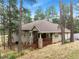 Ranch style home with wood deck, stone accents, and a three-car garage at 4381 Cheyenne Dr, Larkspur, CO 80118
