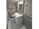 Modern bathroom with white vanity, updated fixtures, and stylish tile work at 4319 Dearborn St, Denver, CO 80239