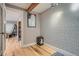 Inviting entryway with geometric wallpaper and a small table at 2460 W Caithness Pl # 104, Denver, CO 80211