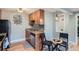 Modern kitchen with granite countertops and stainless steel appliances at 2460 W Caithness Pl # 104, Denver, CO 80211