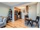 Open concept kitchen and living area with hardwood floors and modern finishes at 2460 W Caithness Pl # 104, Denver, CO 80211
