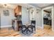 Small, updated kitchenette with breakfast bar seating for two at 2460 W Caithness Pl # 104, Denver, CO 80211