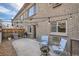 Private patio with fire pit and seating at 2460 W Caithness Pl # 104, Denver, CO 80211