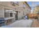 Private patio with grill and seating at 2460 W Caithness Pl # 104, Denver, CO 80211