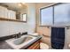 Clean bathroom with updated vanity and shower at 34 S Raleigh St, Denver, CO 80219
