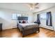 Well-lit bedroom with hardwood floors and a ceiling fan at 34 S Raleigh St, Denver, CO 80219