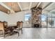 Bright dining room with hardwood floors, stone fireplace, and scenic views at 34 S Raleigh St, Denver, CO 80219