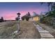 Ranch style home with stone pathway, offering curb appeal at 34 S Raleigh St, Denver, CO 80219