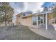 Brick home with a covered patio and large windows at 34 S Raleigh St, Denver, CO 80219
